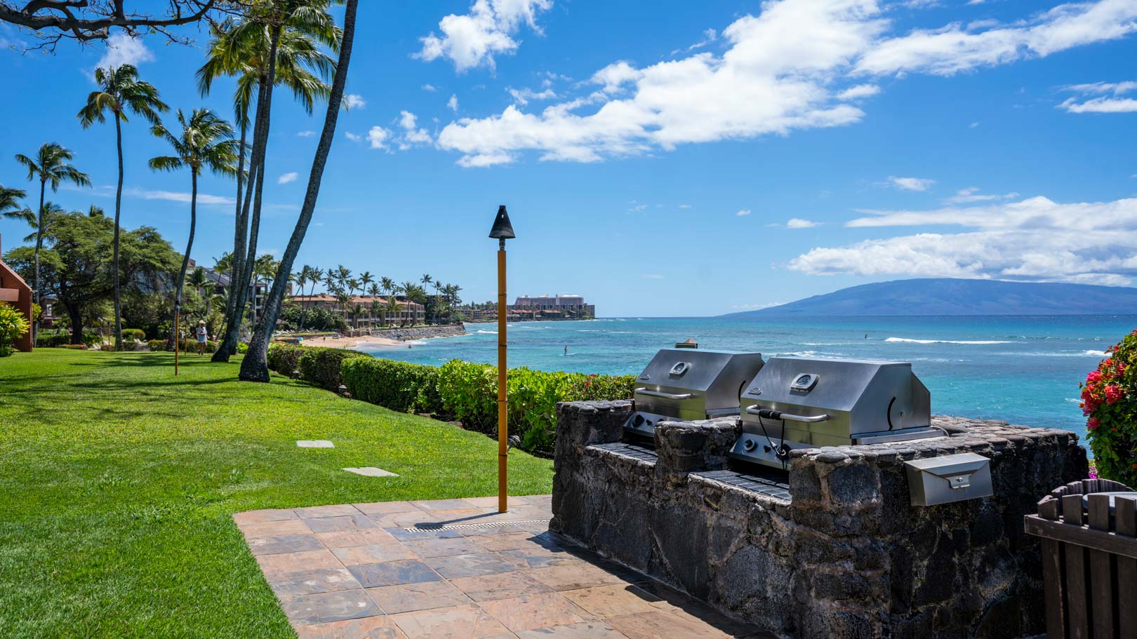 Outdoor grills facing the beach at VRI's Kuleana Club in Maui, Hawaii.